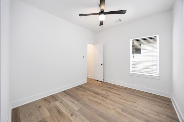 8019 Cora St, Houston, TX 77088 - empty room featuring ceiling fan, baseboards, and light wood-style flooring