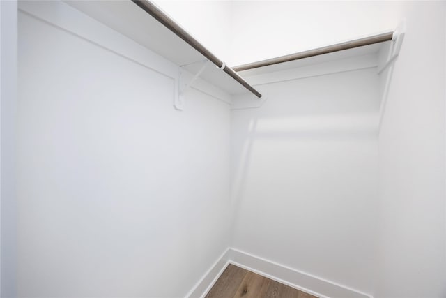 8019 Cora St, Houston, TX 77088 - spacious closet featuring dark wood-style flooring