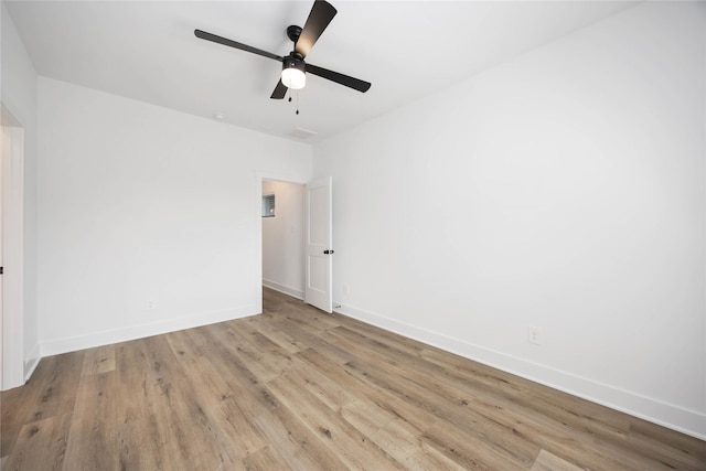 8019 Cora St, Houston, TX 77088 - spare room with wood finished floors, baseboards, and a ceiling fan