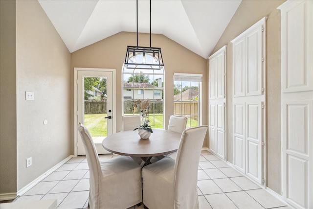 4643 Forest Home Dr, Missouri City, TX 77459 - dining space featuring light tile patterned floors, lofted ceiling, and baseboards