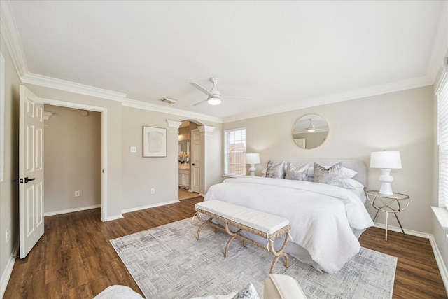 4643 Forest Home Dr, Missouri City, TX 77459 - bedroom featuring crown molding, baseboards, wood finished floors, arched walkways, and decorative columns