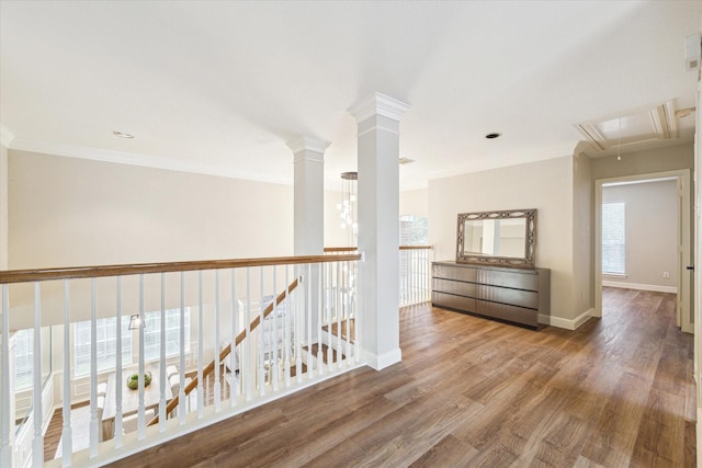 4643 Forest Home Dr, Missouri City, TX 77459 - hallway featuring attic access, wood finished floors, crown molding, and baseboards