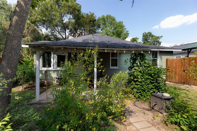 404 E Alabama St, Wharton, TX 77488 - rear view of property with roof with shingles and a patio