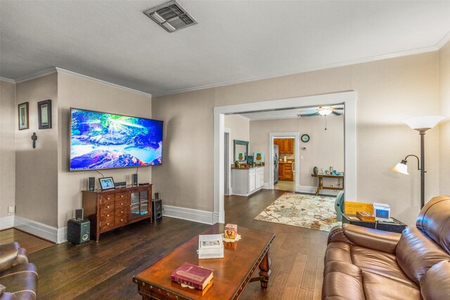 404 E Alabama St, Wharton, TX 77488 - living room featuring wood finished floors, crown molding, baseboards, and ceiling fan
