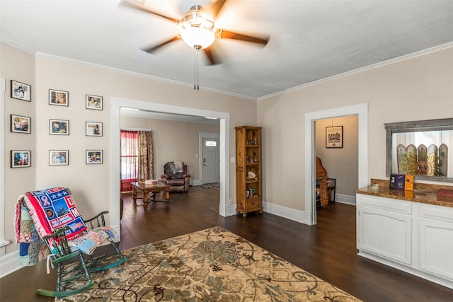 404 E Alabama St, Wharton, TX 77488 - living area with a ceiling fan, dark wood-style flooring, ornamental molding, plenty of natural light, and baseboards