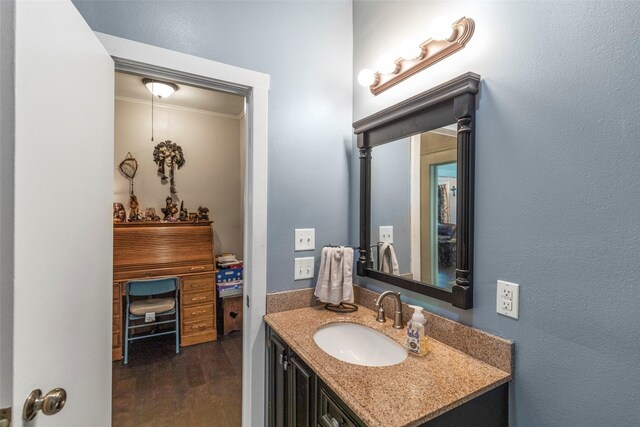 404 E Alabama St, Wharton, TX 77488 - bathroom featuring vanity and wood finished floors