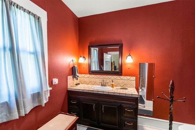 404 E Alabama St, Wharton, TX 77488 - bathroom with tasteful backsplash and vanity