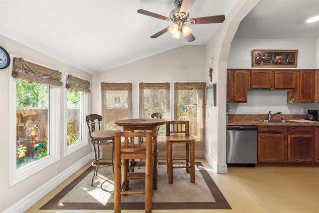 404 E Alabama St, Wharton, TX 77488 - dining space with vaulted ceiling, ceiling fan, and baseboards