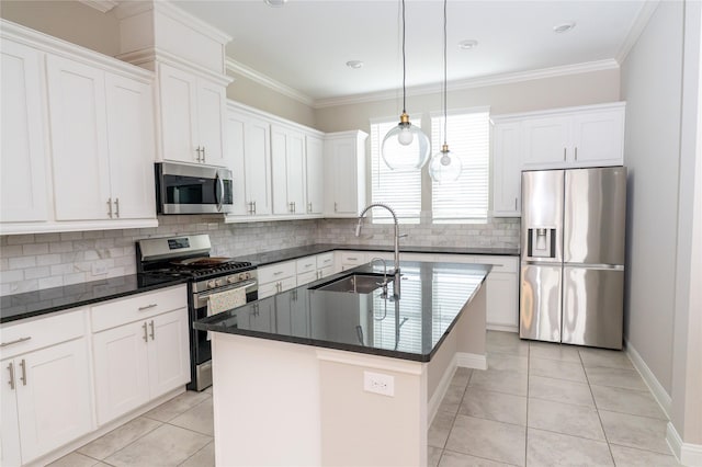 8408 Oak Leaf Point Dr, Houston, TX 77055 - kitchen featuring stainless steel appliances, a sink, light tile patterned floors, a center island with sink, and backsplash