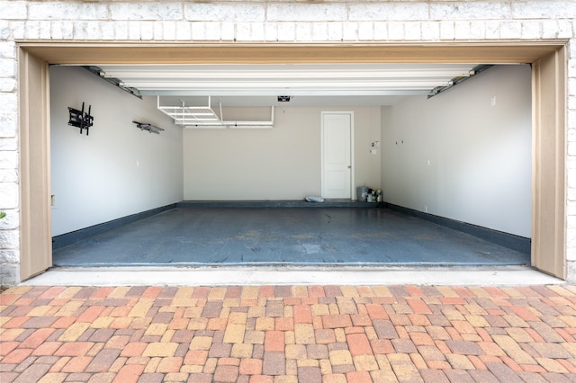 8408 Oak Leaf Point Dr, Houston, TX 77055 - garage featuring baseboards