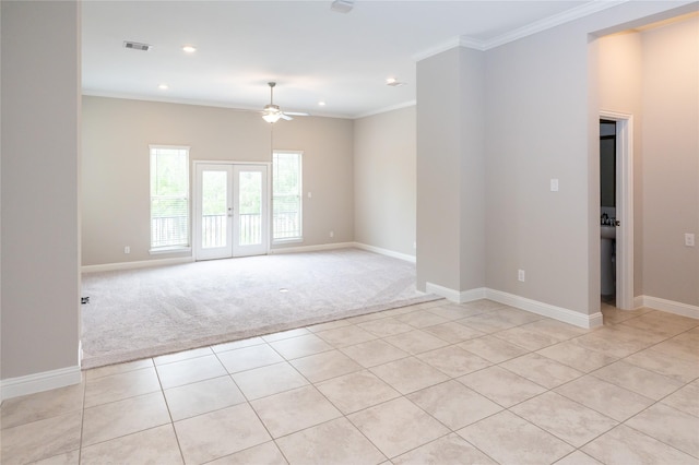 8408 Oak Leaf Point Dr, Houston, TX 77055 - empty room featuring ceiling fan, light colored carpet, ornamental molding, baseboards, and light tile patterned floors