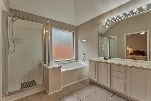 2230 Louetta Falls Ln, Spring, TX 77388 - full bathroom featuring lofted ceiling, tile patterned flooring, a garden tub, a stall shower, and double vanity