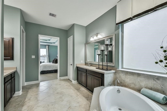 29506 Highland Manor Ct, Katy, TX 77494 - full bath with vanity, a bath, ensuite bathroom, and baseboards