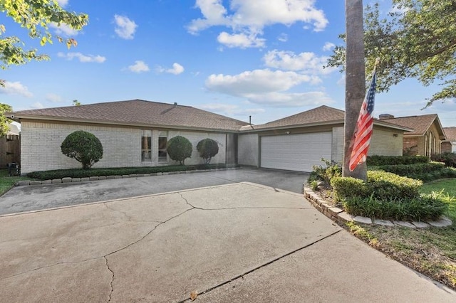 2505 Gerol Dr, Galveston, TX 77551 - ranch-style home with brick siding, a garage, and driveway