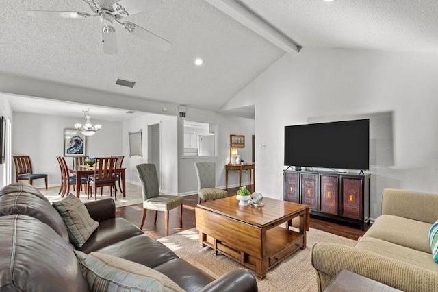 2505 Gerol Dr, Galveston, TX 77551 - living room with wood finished floors, a ceiling fan, a textured ceiling, a chandelier, and baseboards