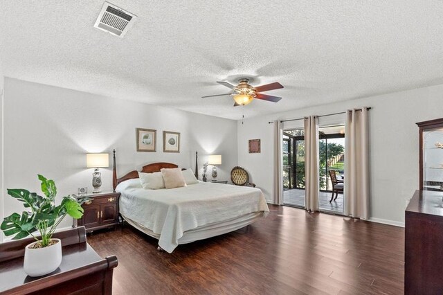 2505 Gerol Dr, Galveston, TX 77551 - bedroom with access to exterior, dark wood-type flooring, a textured ceiling, ceiling fan, and baseboards