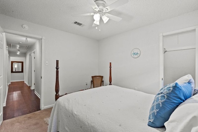 2505 Gerol Dr, Galveston, TX 77551 - bedroom with attic access, a textured ceiling, carpet, ceiling fan, and baseboards