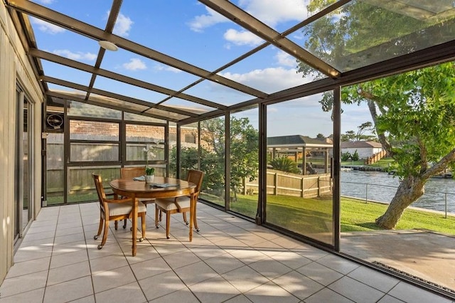 2505 Gerol Dr, Galveston, TX 77551 - sunroom / solarium featuring a water view, outdoor dining space, and vaulted ceiling