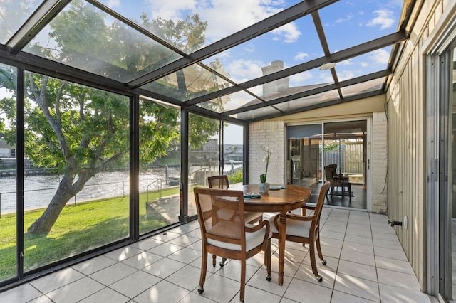 2505 Gerol Dr, Galveston, TX 77551 - sunroom / solarium with a water view, plenty of natural light, and outdoor dining space