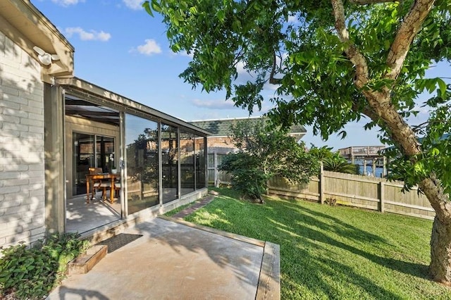 2505 Gerol Dr, Galveston, TX 77551 - view of yard with a sunroom and a patio area