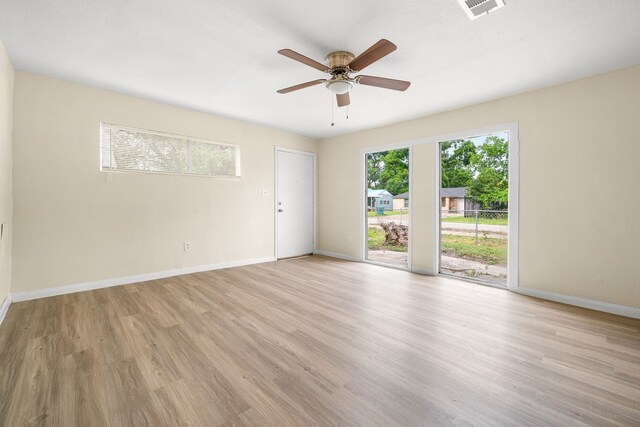 4726 Angleton St, Houston, TX 77033 - empty room with ceiling fan, baseboards, and light wood-style flooring