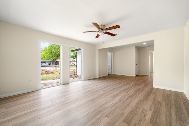 4726 Angleton St, Houston, TX 77033 - spare room with light wood-style floors, a ceiling fan, and baseboards