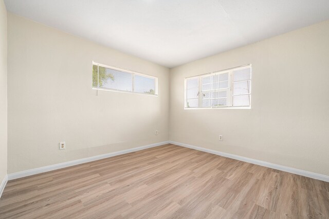 4726 Angleton St, Houston, TX 77033 - empty room with light wood-style flooring and baseboards