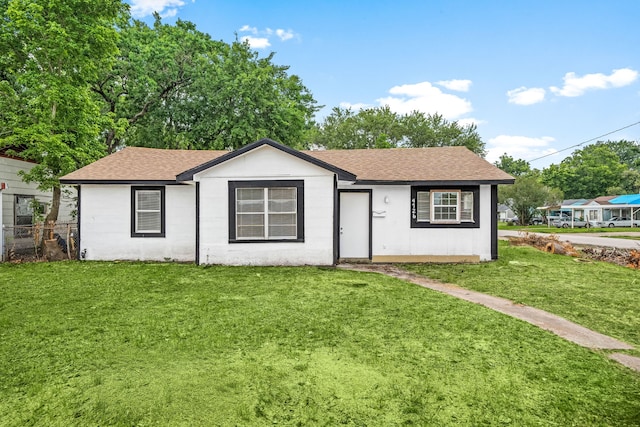 4726 Angleton St, Houston, TX 77033 - ranch-style home with a front lawn and roof with shingles