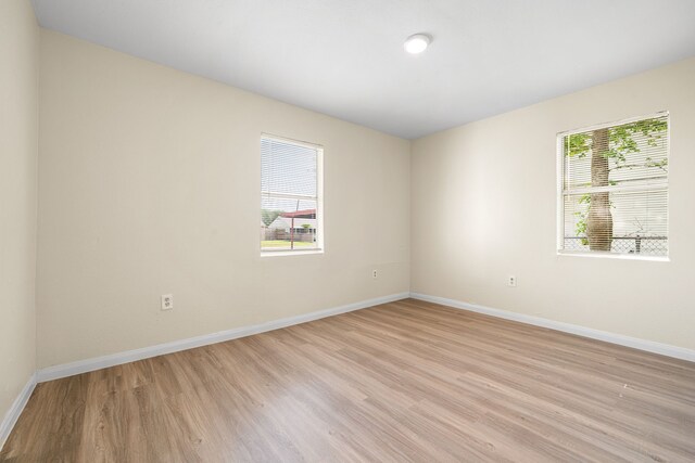 4726 Angleton St, Houston, TX 77033 - unfurnished room with light wood-style floors and baseboards