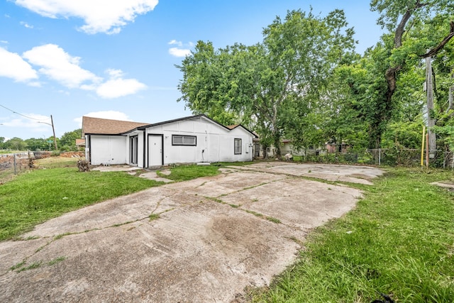 4726 Angleton St, Houston, TX 77033 - rear view of house with concrete driveway