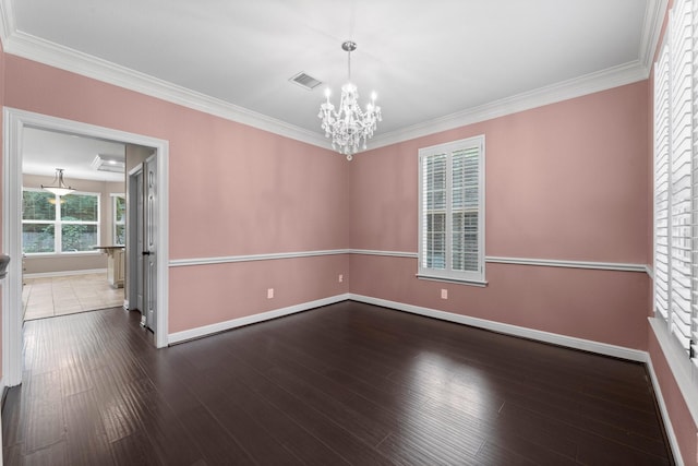 62 Treescape Cir, The Woodlands, TX 77381 - empty room with a chandelier, baseboards, ornamental molding, and wood finished floors