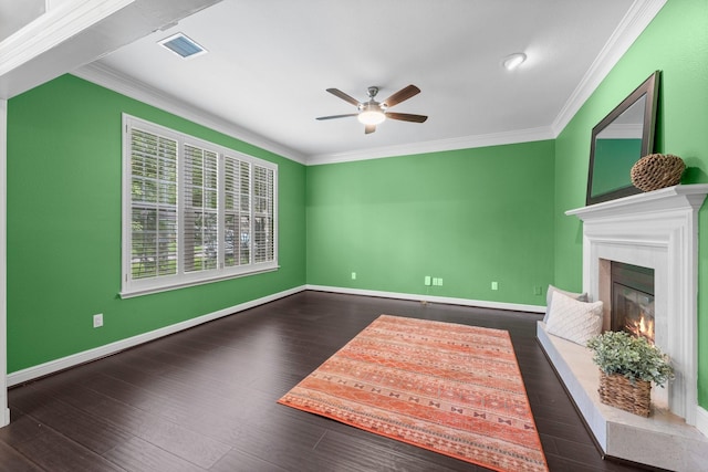62 Treescape Cir, The Woodlands, TX 77381 - unfurnished living room with a ceiling fan, ornamental molding, wood finished floors, a warm lit fireplace, and baseboards