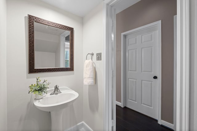 62 Treescape Cir, The Woodlands, TX 77381 - bathroom with wood finished floors and baseboards