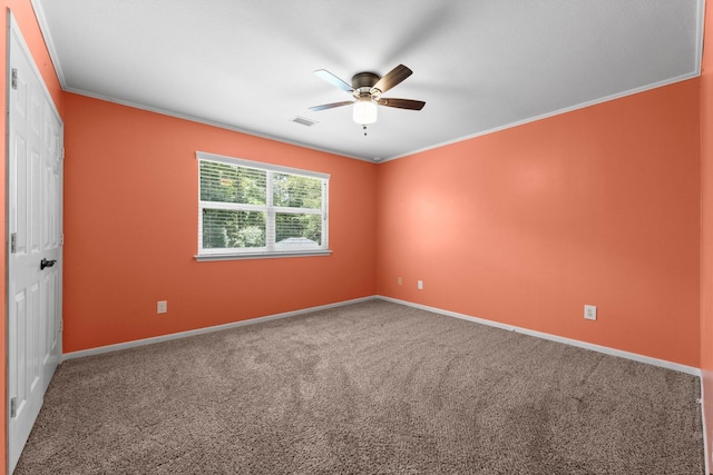 62 Treescape Cir, The Woodlands, TX 77381 - spare room with crown molding, ceiling fan, carpet floors, and baseboards