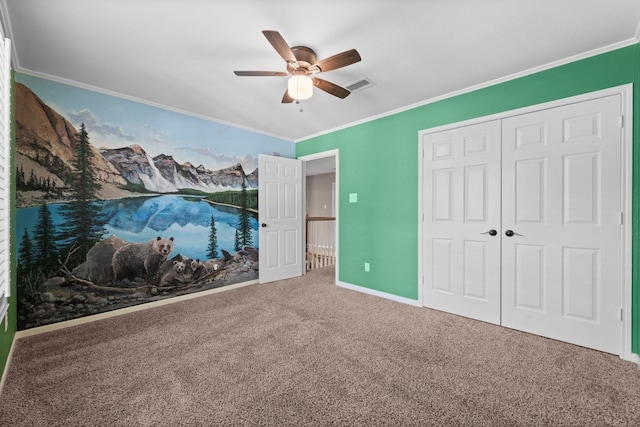 62 Treescape Cir, The Woodlands, TX 77381 - unfurnished bedroom featuring carpet flooring, crown molding, a closet, ceiling fan, and baseboards
