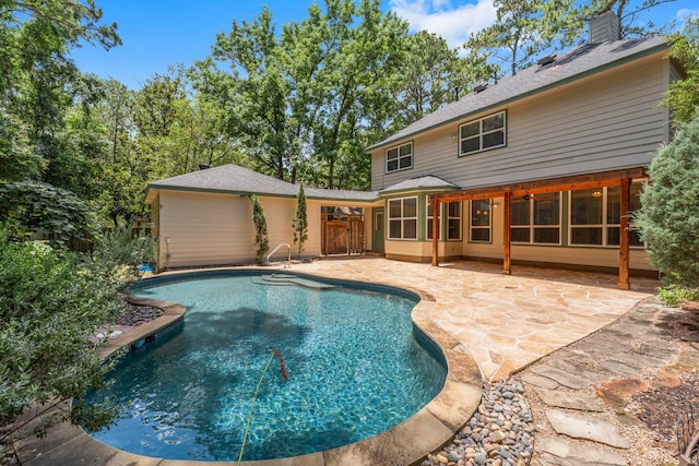 62 Treescape Cir, The Woodlands, TX 77381 - outdoor pool featuring a patio