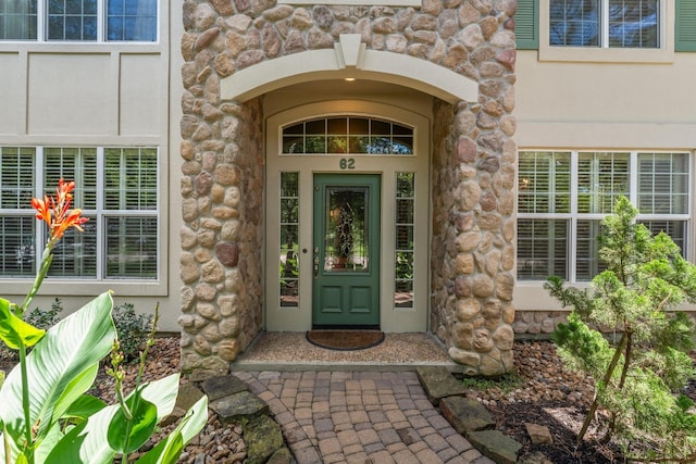 62 Treescape Cir, The Woodlands, TX 77381 - entrance to property featuring stone siding and stucco siding