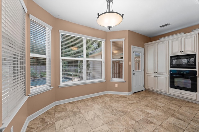 62 Treescape Cir, The Woodlands, TX 77381 - kitchen with black appliances, decorative light fixtures, and baseboards