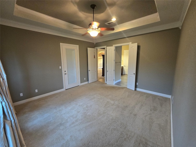 1008 Heritage Oaks Dr, Angleton, TX 77515 - unfurnished bedroom featuring a raised ceiling, ornamental molding, light colored carpet, baseboards, and a ceiling fan