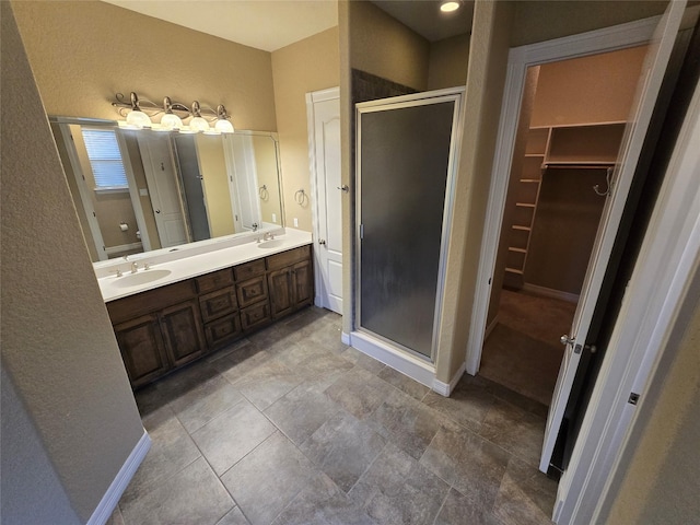1008 Heritage Oaks Dr, Angleton, TX 77515 - full bathroom with a shower stall, double vanity, and a walk in closet