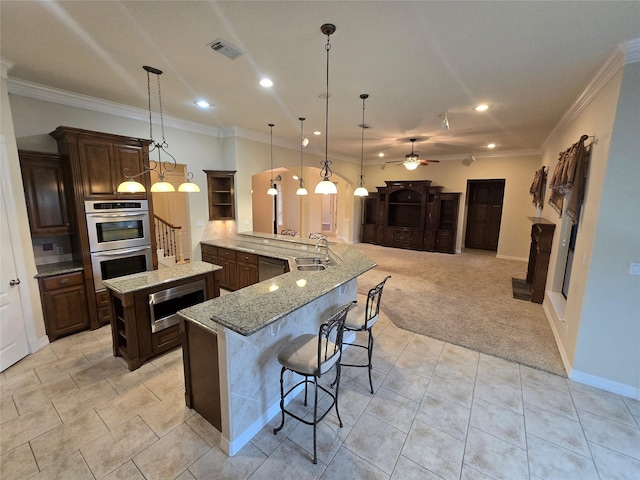 1008 Heritage Oaks Dr, Angleton, TX 77515 - kitchen with open shelves, appliances with stainless steel finishes, recessed lighting, ceiling fan, and crown molding