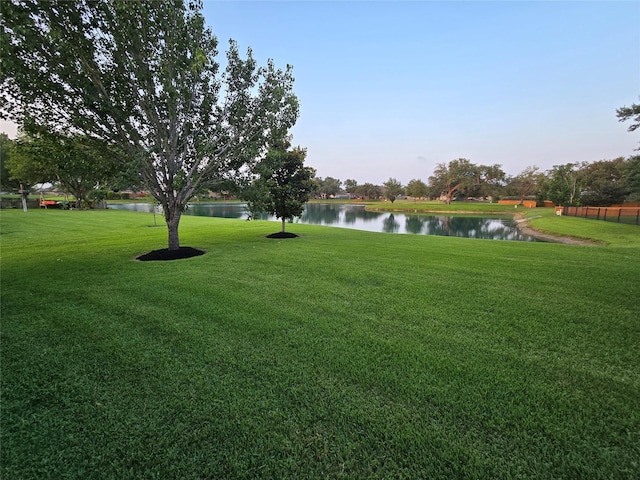 1008 Heritage Oaks Dr, Angleton, TX 77515 - view of grassy yard featuring a water view