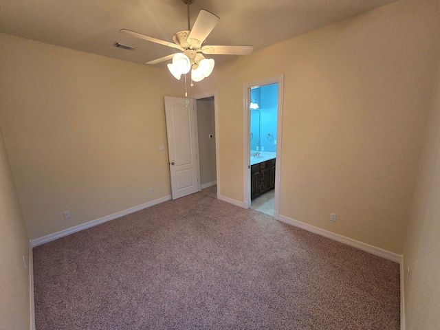 1008 Heritage Oaks Dr, Angleton, TX 77515 - spare room featuring a ceiling fan, light colored carpet, and baseboards