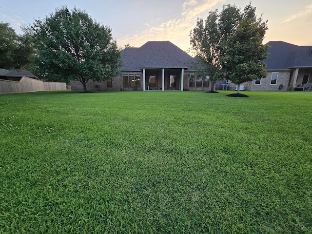 1008 Heritage Oaks Dr, Angleton, TX 77515 - view of yard at dusk