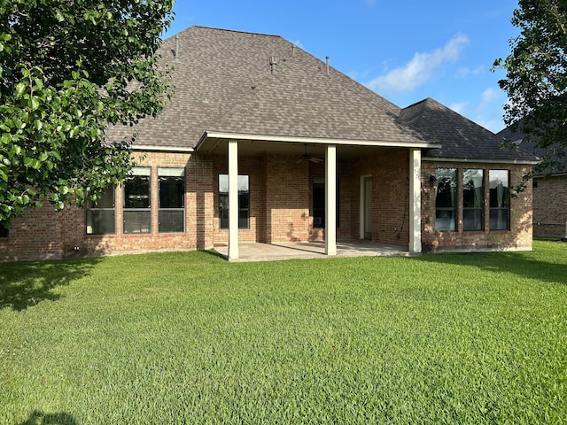 1008 Heritage Oaks Dr, Angleton, TX 77515 - back of house with a ceiling fan, roof with shingles, a patio, a yard, and brick siding