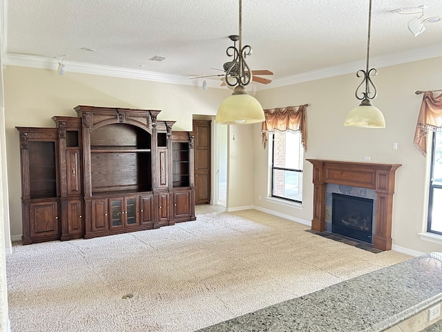 1008 Heritage Oaks Dr, Angleton, TX 77515 - unfurnished living room featuring ceiling fan, a textured ceiling, crown molding, carpet floors, and a premium fireplace