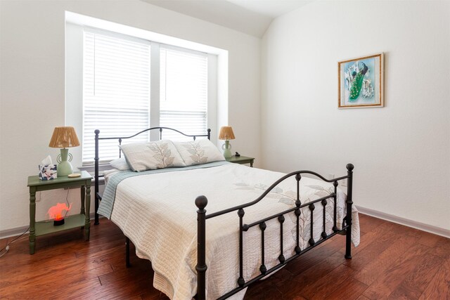 17218 Marquette Point Ln, Humble, TX 77346 - bedroom with wood-type flooring, vaulted ceiling, and baseboards