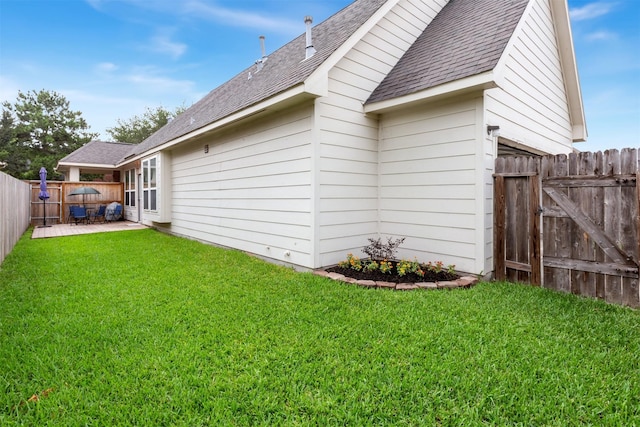17218 Marquette Point Ln, Humble, TX 77346 - back of house featuring roof with shingles and a patio area