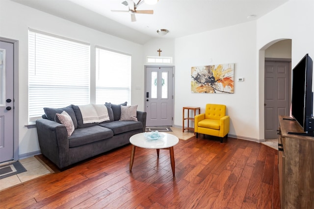 17218 Marquette Point Ln, Humble, TX 77346 - living room with arched walkways, wood-type flooring, a ceiling fan, vaulted ceiling, and baseboards