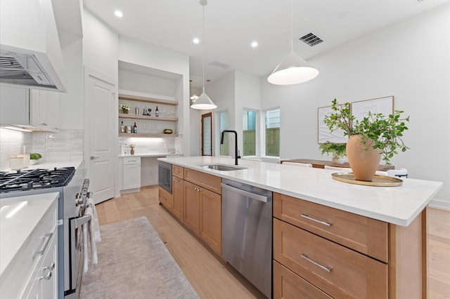 432 W 24th St, Houston, TX 77008 - kitchen with appliances with stainless steel finishes, a sink, custom range hood, light wood-type flooring, and open shelves